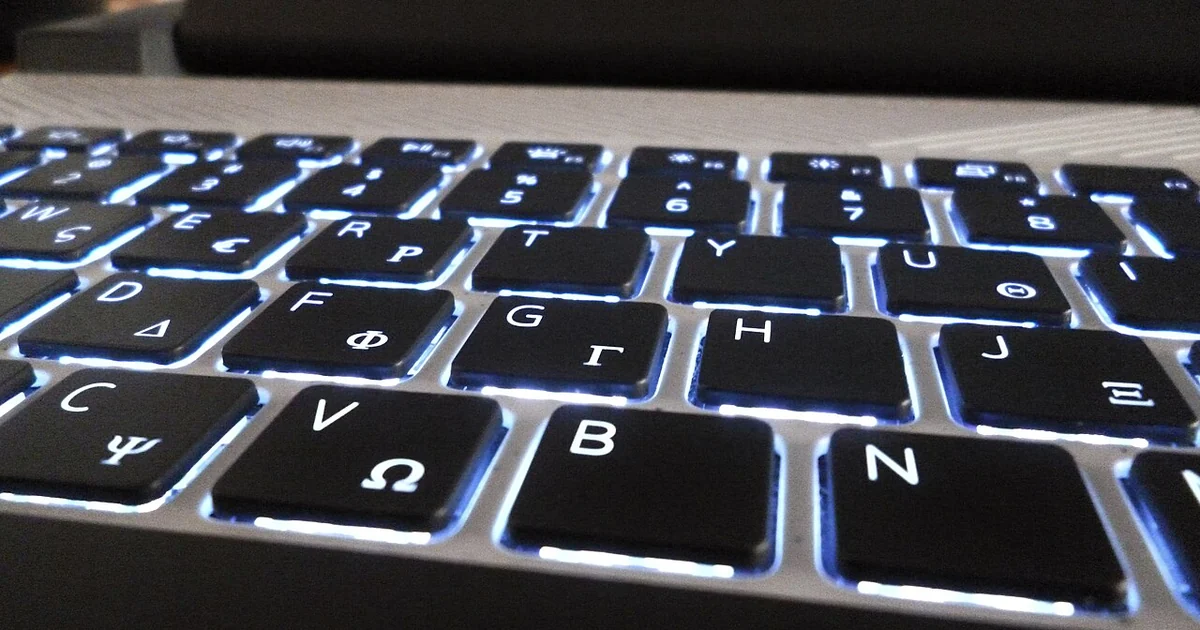 A keyboard of a laptop, with a backlight.